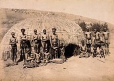 South Africa: Africans in front of a traditional kraal hut, between 1800 and 1899. Creator: Unknown