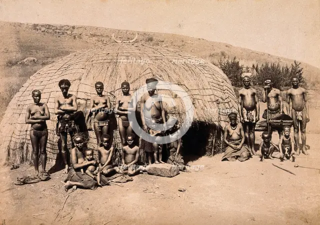 South Africa: Africans in front of a traditional kraal hut, between 1800 and 1899. Creator: Unknown.