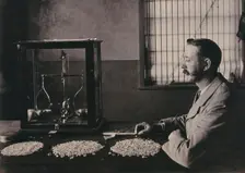 South Africa: an employee of De Beers counting the diamonds mined that day, 1896. Creator: Unknown