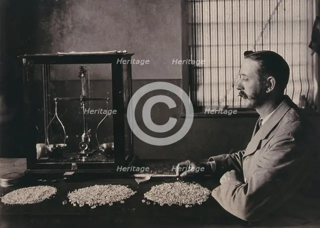 South Africa: an employee of De Beers counting the diamonds mined that day, 1896. Creator: Unknown.