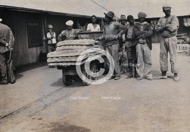 South Africa: bread carried on trolleys for the African workers at De Beers Mine, 1905. Creator: Hugh Marshall.