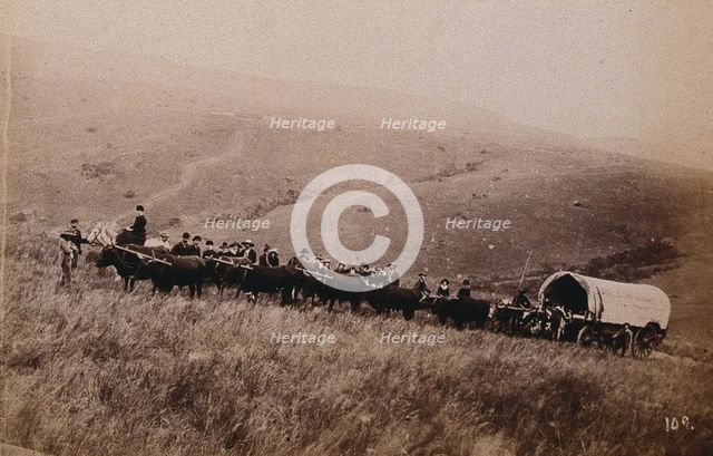 South Africa: landscape with people, a wagon and oxen in the foreground, 1896. Creator: Unknown.