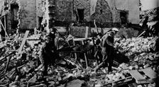 South Wales had its turn early in the New Year. A stretcher party carries a casualty to safety 19