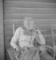 Southern lady of the old school on the veranda...of the Wray Plantation, Georgia, 1937. Creator: Dorothea Lange