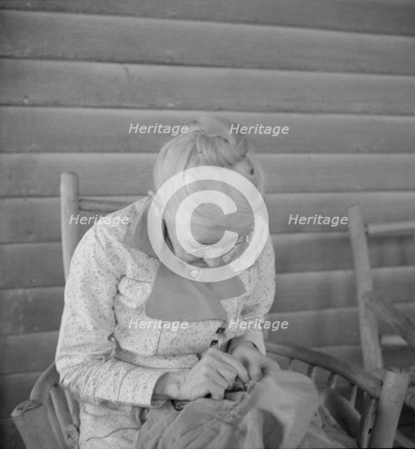 Southern lady of the old school on veranda...at the Wray Plantation, Georgia, 1937. Creator: Dorothea Lange.