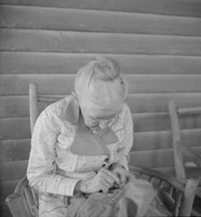 Southern lady of the old school on veranda...at the Wray Plantation, Georgia, 1937. Creator: Dorothea Lange