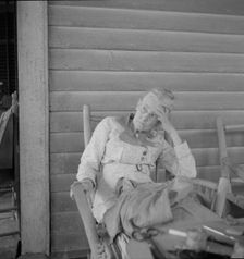 Southern lady on the veranda of the "Big House" at the Wray Plantation, Georgia, 1937. Creator: Dorothea Lange