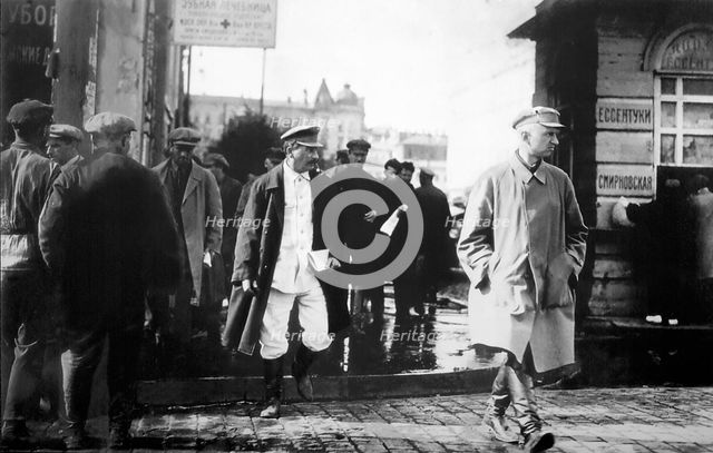Soviet leader Joseph Stalin escorted by GRU secret agents, late 1920s. Artist: Anon