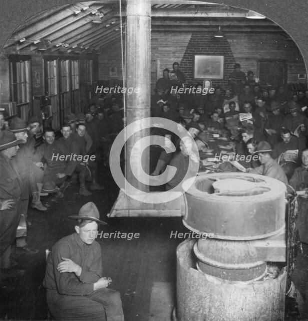 Social room of a YMCA army camp hut, early 20th century. Artist: Keystone View Company