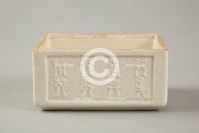 Soft paste rectangular vessel with characters in relief, early 19th century. Creator: Unknown.