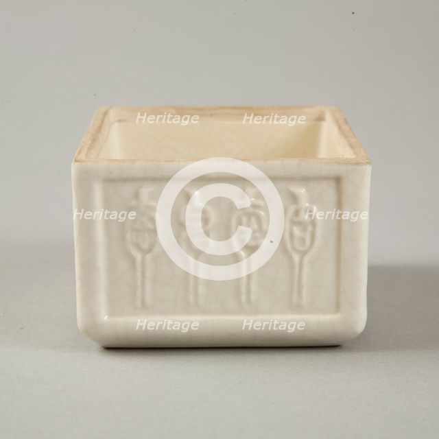 Soft paste rectangular vessel with characters in relief, early 19th century. Creator: Unknown.