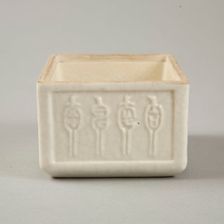 Soft paste rectangular vessel with characters in relief, early 19th century. Creator: Unknown