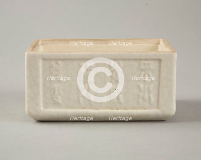 Soft paste rectangular vessel with characters in relief, early 19th century. Creator: Unknown.