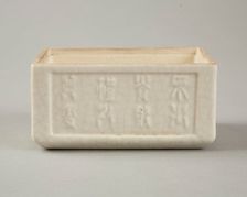 Soft paste rectangular vessel with characters in relief, early 19th century. Creator: Unknown