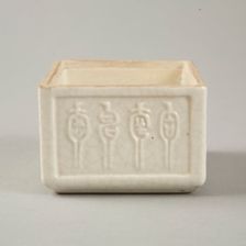 Soft paste rectangular vessel with characters in relief, early 19th century. Creator: Unknown