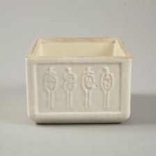 Soft paste rectangular vessel with characters in relief, early 19th century