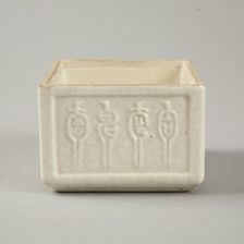 Soft paste rectangular vessel with characters in relief, early 19th century