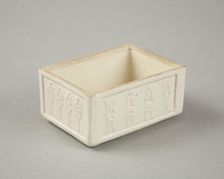 Soft paste rectangular vessel with characters in relief, early 19th century