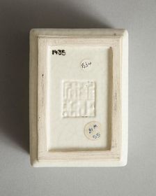 Soft paste rectangular vessel with characters in relief, early 19th century