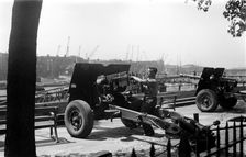 Soldier cleaning a gun, London, c1945-c1965. Artist: SW Rawlings