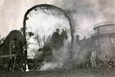 Soldier on horseback jumping through a flaming arch, Fort Sheridan, Illinois, USA, 1920