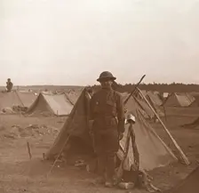 Soldier standing by tent, American camp, Melette, France, c1914-c1918