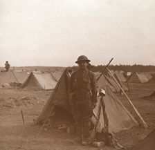 Soldier standing by tent, American camp, Melette, France, c1914-c1918