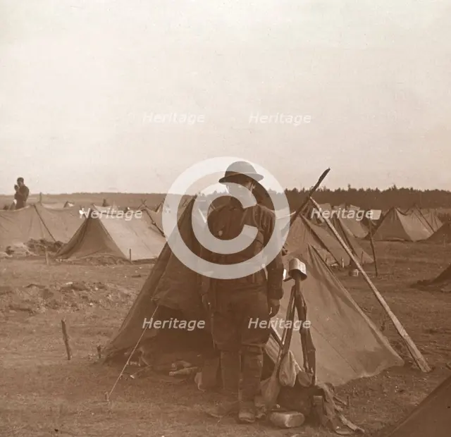 Soldier standing by tent, American camp, Melette, France, c1914-c1918.  Artist: Unknown.