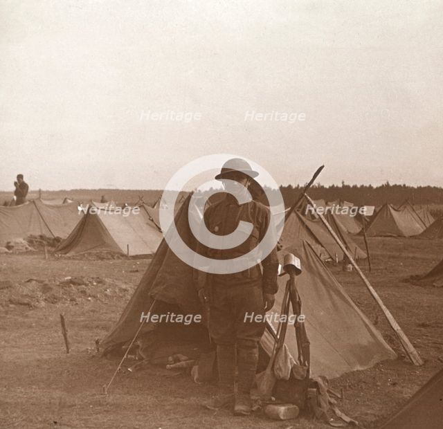 Soldier standing by tent, American camp, Melette, France, c1914-c1918.  Artist: Unknown.