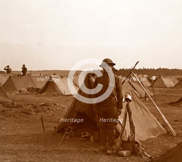 Soldier standing by tent, American camp, Melette, France, c1914-c1918.  Artist: Unknown.