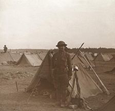 Soldier standing by tent, American camp, Melette, France, c1914-c1918