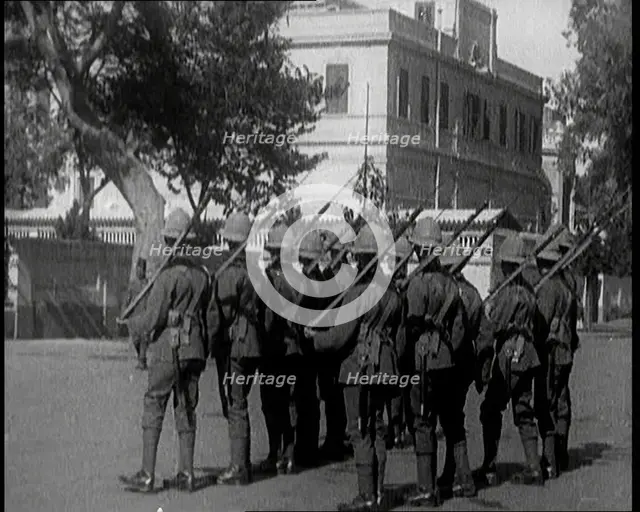 Soldiers Carrying Rifles Patrolling Outside the Egyptian Palace After the Assassination of ..., 1924 Creator: British Pathe Ltd.