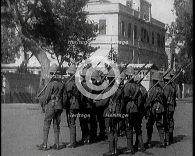 Soldiers Carrying Rifles Patrolling Outside the Egyptian Palace After the Assassination of ..., 1924 Creator: British Pathe Ltd.