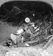 Soldiers cutting through barbed wire defences, Oppy, France, World War I, 1914-1918.Artist: Realistic Travels Publishers