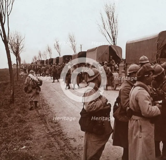 Soldiers and column of trucks on the Voie Sacrée, Verdun, northern France, c1914-c1918. Artist: Unknown.