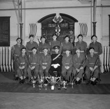 Soldiers and their officer in front of the Honourable Artillery Company's War Memorial, c1945-c1965. Artist: SW Rawlings