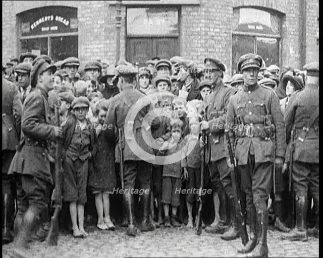 Soldiers Holding Back Children in Dublin, 1922. Creator: British Pathe Ltd.
