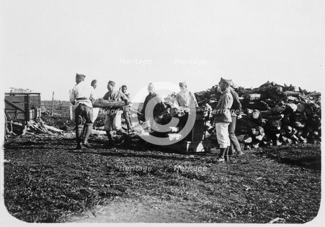 Soldiers of the French Foreign Legion stacking logs, Syria, 20th century. Artist: Unknown