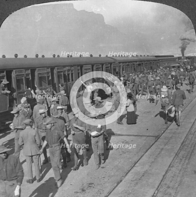 Soldiers of the Wiltshire Rifles boarding a train, Cape Town, South Africa, World War I, c1915. Artist: Realistic Travels Publishers