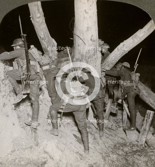 Soldiers leaving a trench for a night raid at Messines, Belgium, World War I, 1914-1918.Artist: Realistic Travels Publishers