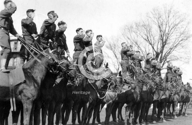 Soldiers saluting while standing on horseback, Fort Sheridan, Illinois, USA, 1920. Artist: Unknown