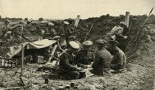 Soldiers playing cards in the trenches, First World War, c1916, (c1920). Creator: Unknown