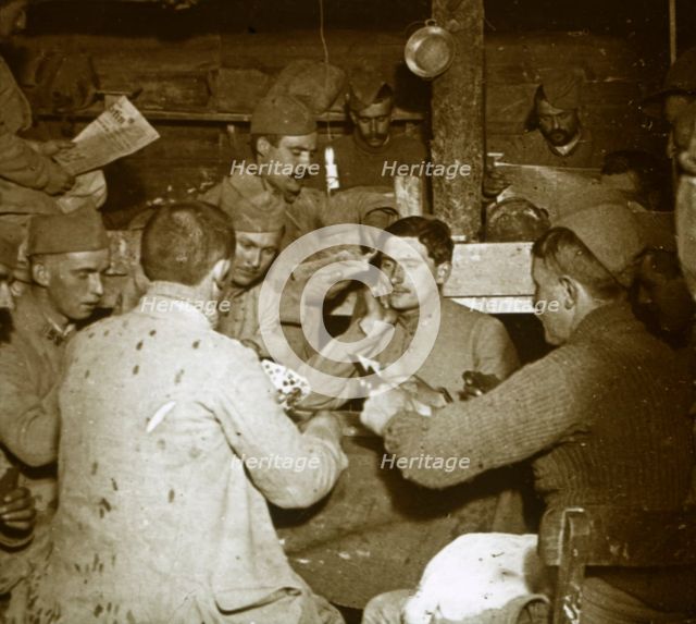 Soldiers playing Manille [card game] in the trenches, c1914-c1918. Artist: Unknown.