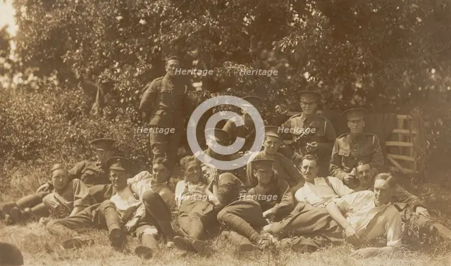 Soldiers relaxing in a field, (between 1910 and 1919?). Creator: Unknown.