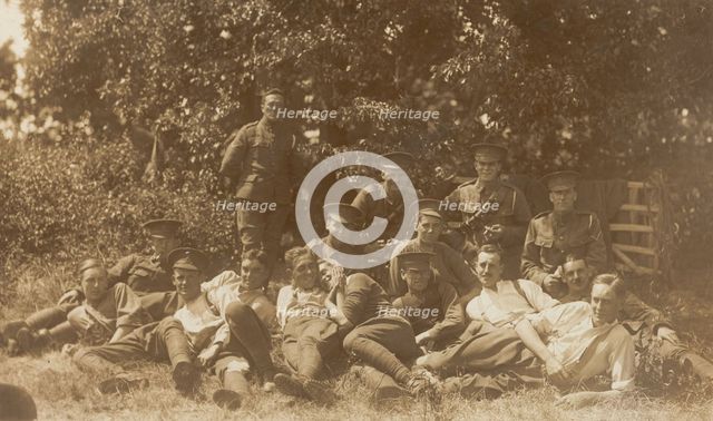 Soldiers relaxing in a field, (between 1910 and 1919?). Creator: Unknown.