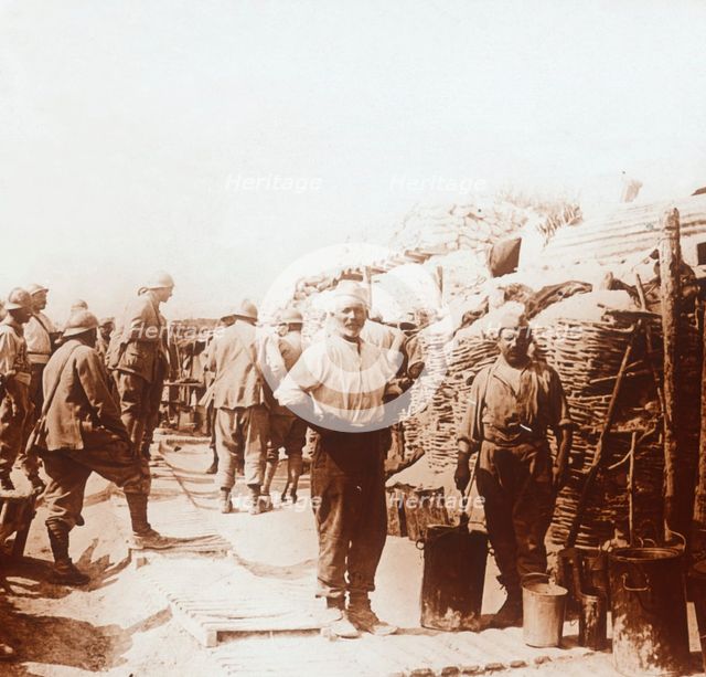 Soldiers with metal containers, c1914-c1918. Artist: Unknown.