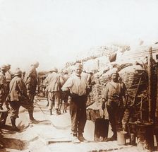 Soldiers with metal containers, c1914-c1918