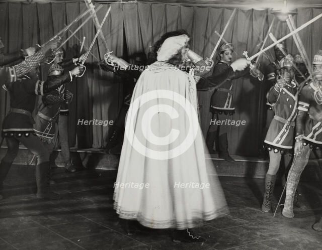 Soldiers with swords raised, 1936. Creator: Eagle Ezzes & Mipaas.