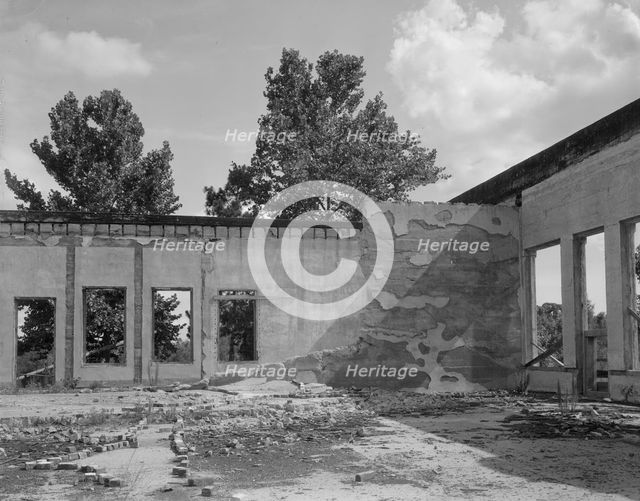 Some of the walls of the bank still stand at Fullerton, Louisiana, abandoned lumber town, 1937. Creator: Dorothea Lange.