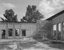 Some of the walls of the bank still stand at Fullerton, Louisiana, abandoned lumber town, 1937. Creator: Dorothea Lange